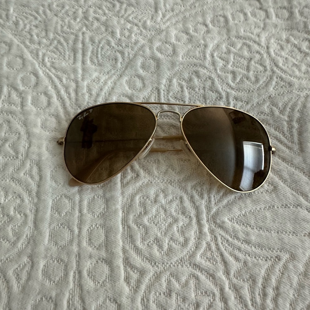 Gold RayBans w/ Case. In good condition, a chip on one lense, shown in pictures